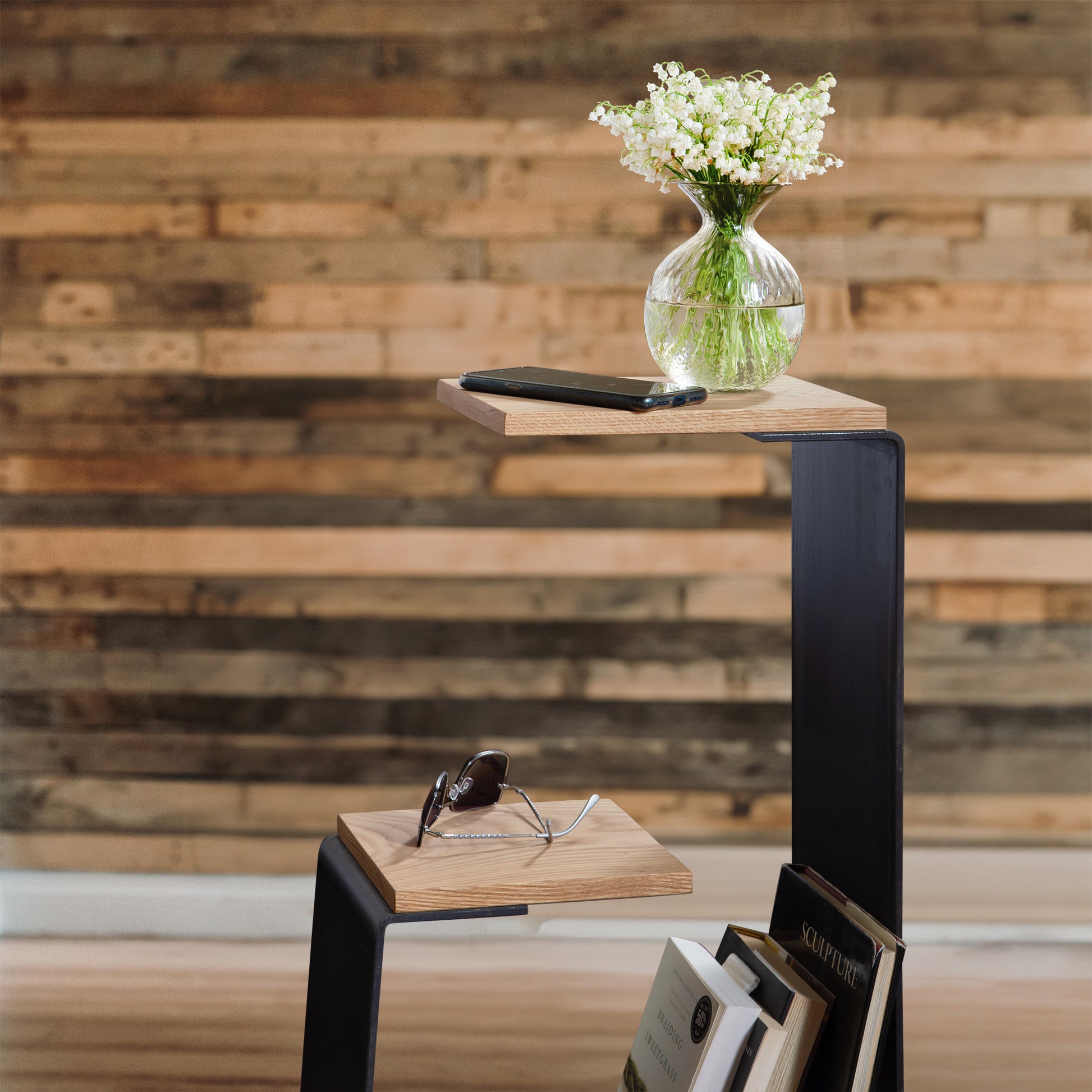 The G Table by Vermont Woods Studios, a modern geometric wooden shelf with multiple tiers, designed to display small items and books.