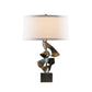 A Hubbardton Forge Gallery Two Fold Table Lamp, with a unique design, featuring a black base and a white shade.