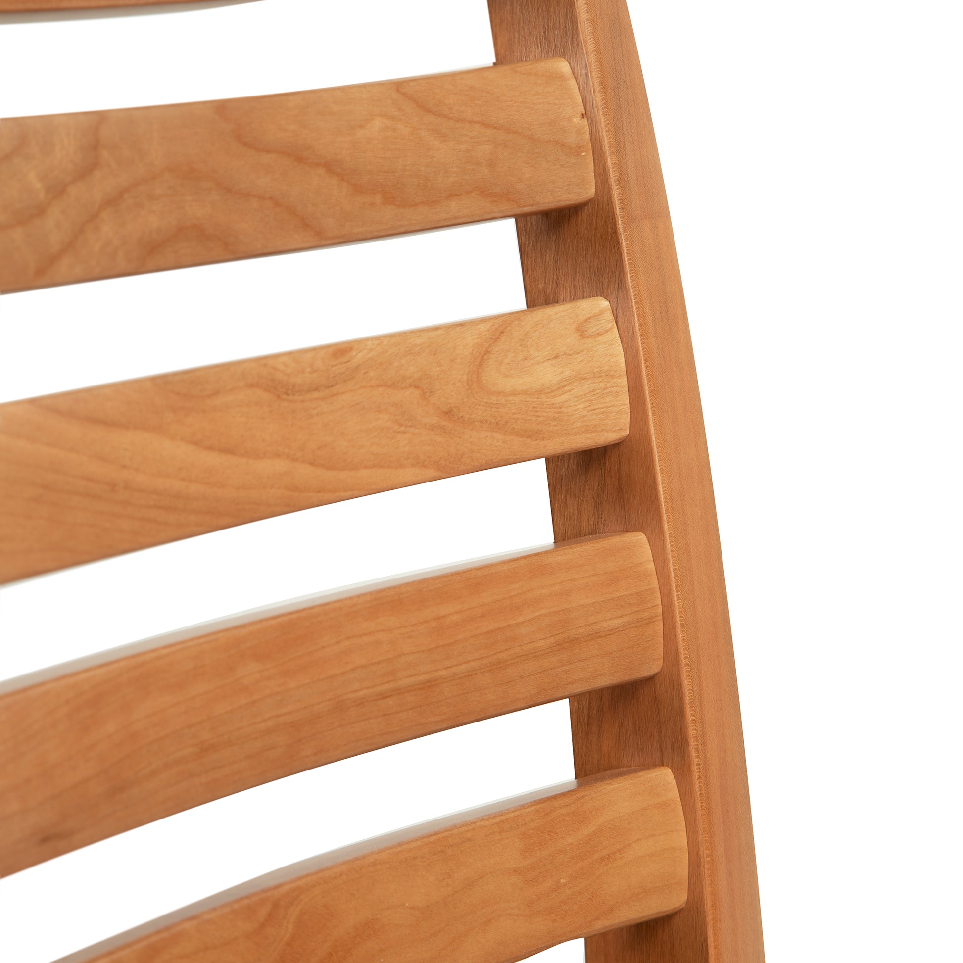 Close-up of natural cherry curved wooden slats on the Grafton Chair by Vermont Woods Studios, highlighting American made craftsmanship.