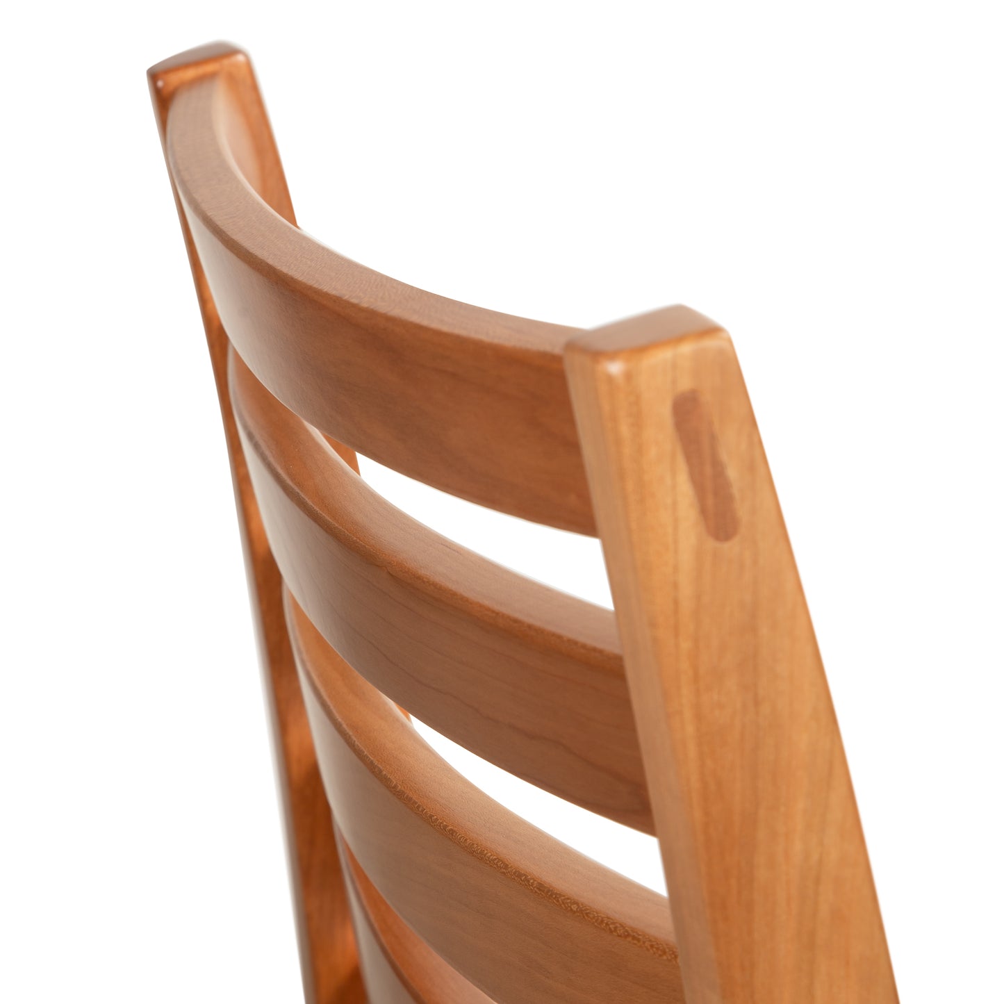 Grafton Chair by Vermont Woods Studios with a smooth, curved natural wood backrest and horizontal slats, highlighting American craftsmanship.