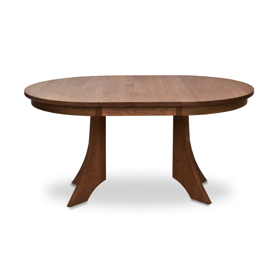 A Lyndon Furniture handcrafted, extendable Hampton Split Pedestal Extension Table with a wooden base.