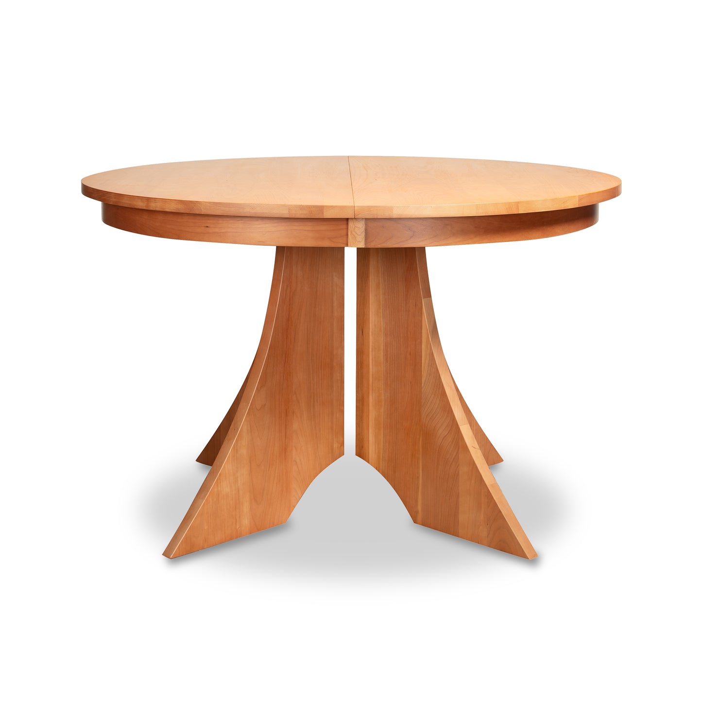 Lyndon Furniture Hampton Split Pedestal Extension Table with a round top, center split, and stylish four-angled-leg pedestal base, handcrafted in Vermont.