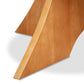 Close-up of the solid wood, geometric angled leg on the Lyndon Furniture Hampton Split Pedestal Extension Table, highlighting craftsmanship.
