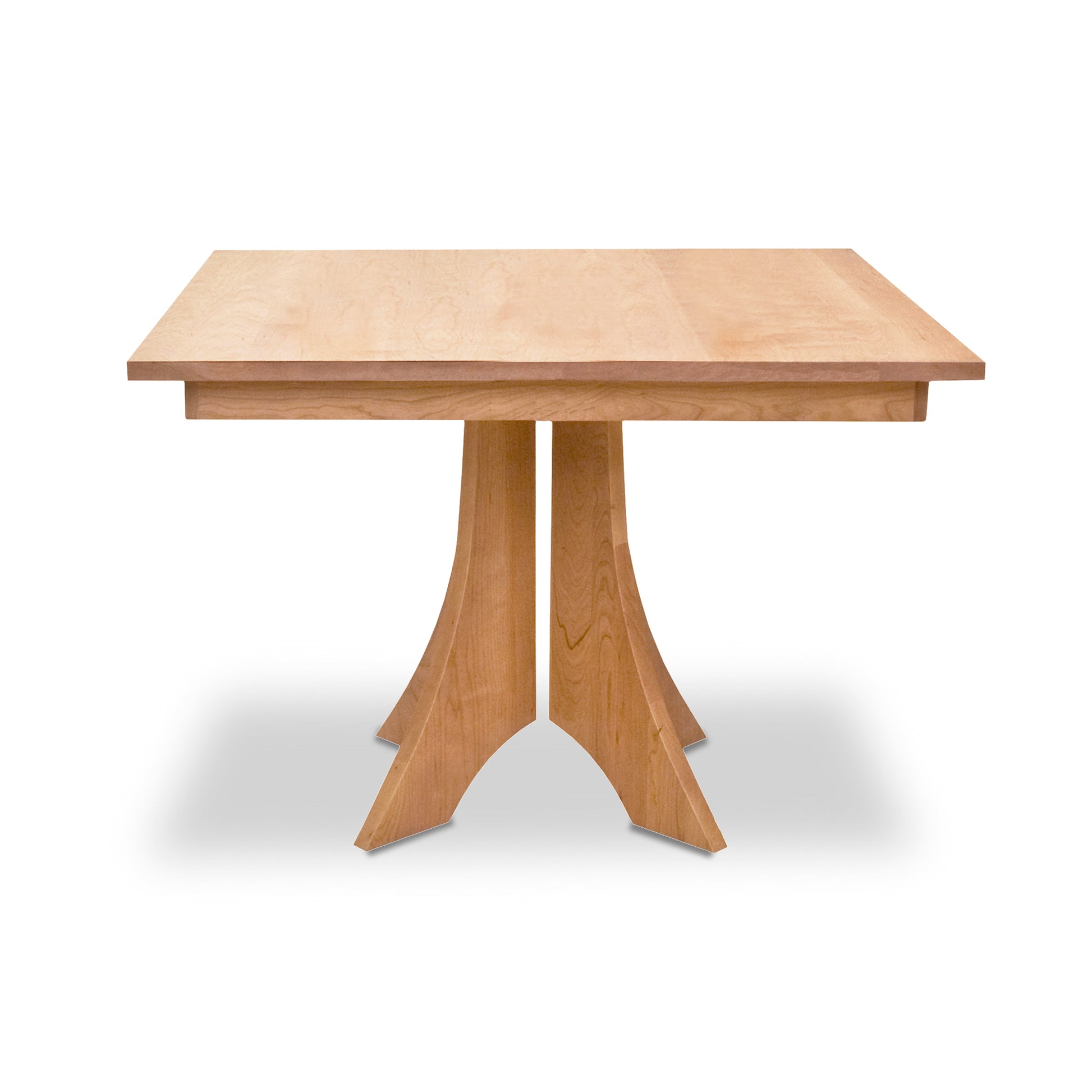 The Hampton Split Pedestal Square Table by Lyndon Furniture is a solid wood, square dining table with intersecting curved legs forming a central base. Handcrafted from high-quality American cherry or walnut wood, this table features a natural finish showcasing beautiful grain patterns. Ideal for modern and minimalist interiors, it offers customizable sizes to fit any dining space. American-made furniture with timeless design and durability.