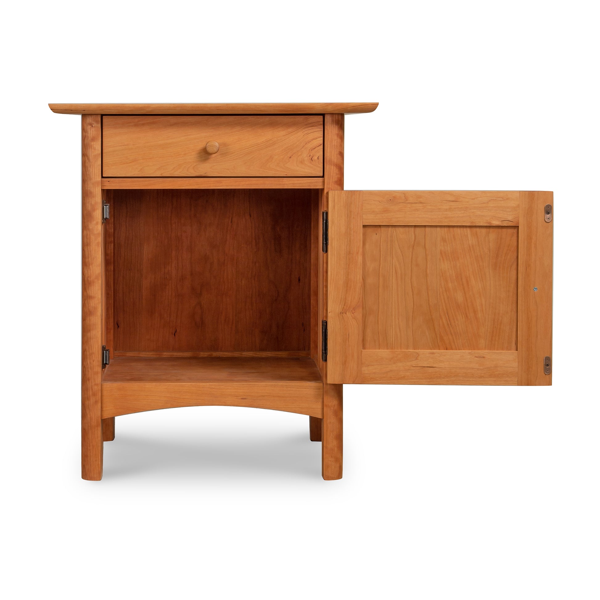 Solid wood Vermont Furniture Designs Heartwood Shaker 1-Drawer Nightstand with Door, showing an empty storage compartment, against a white background.