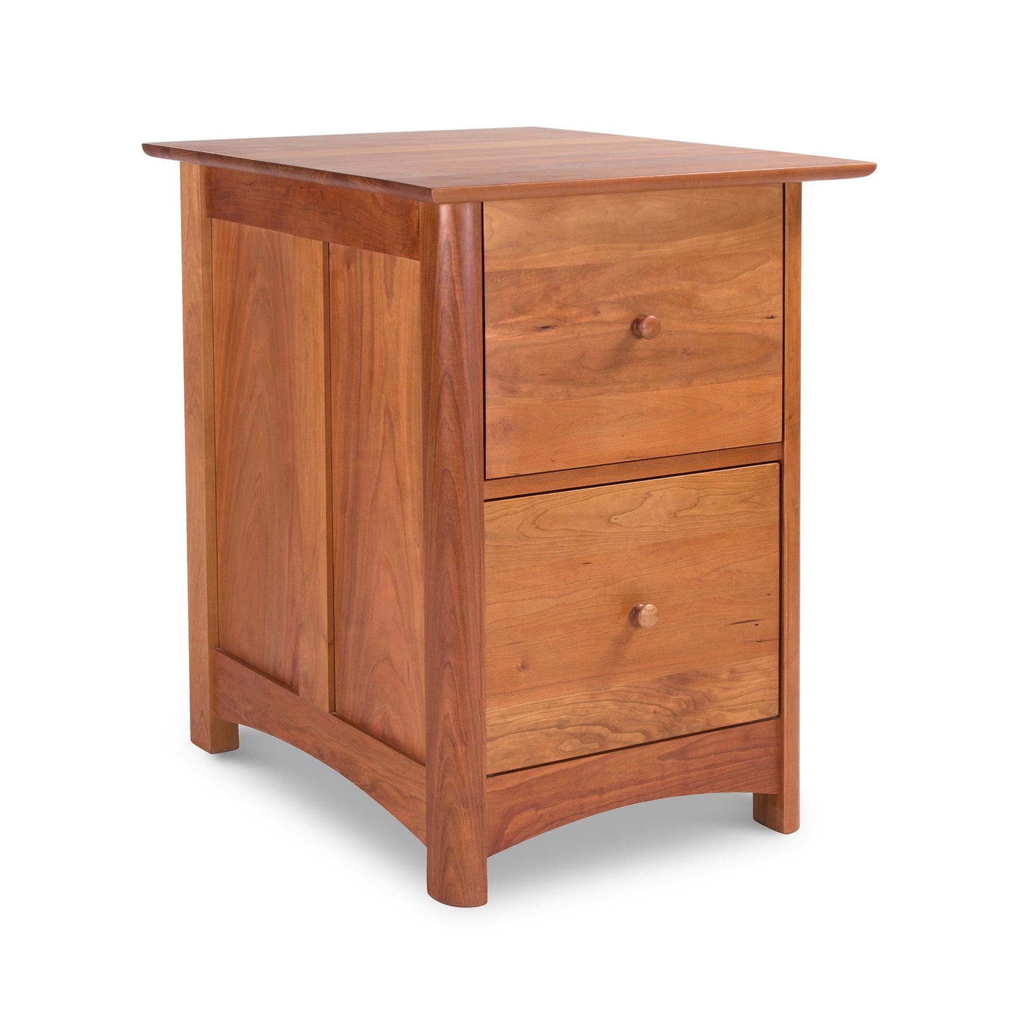 Wooden bedside table, in Vermont Furniture Designs Heartwood Shaker Style with two drawers, isolated on a white background.