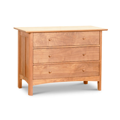 Heartwood Shaker 3-Drawer Chest by Vermont Furniture Designs, featuring solid wood construction, light brown finish, and three spacious drawers with round knobs.