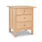 Handcrafted Heartwood Shaker 3-Drawer Nightstand in light wood, featuring four legs and fine Vermont craftsmanship from Vermont Furniture Designs.
