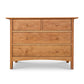 A luxurious Heartwood Shaker 4-Drawer Dresser by Vermont Furniture Designs on a white background.