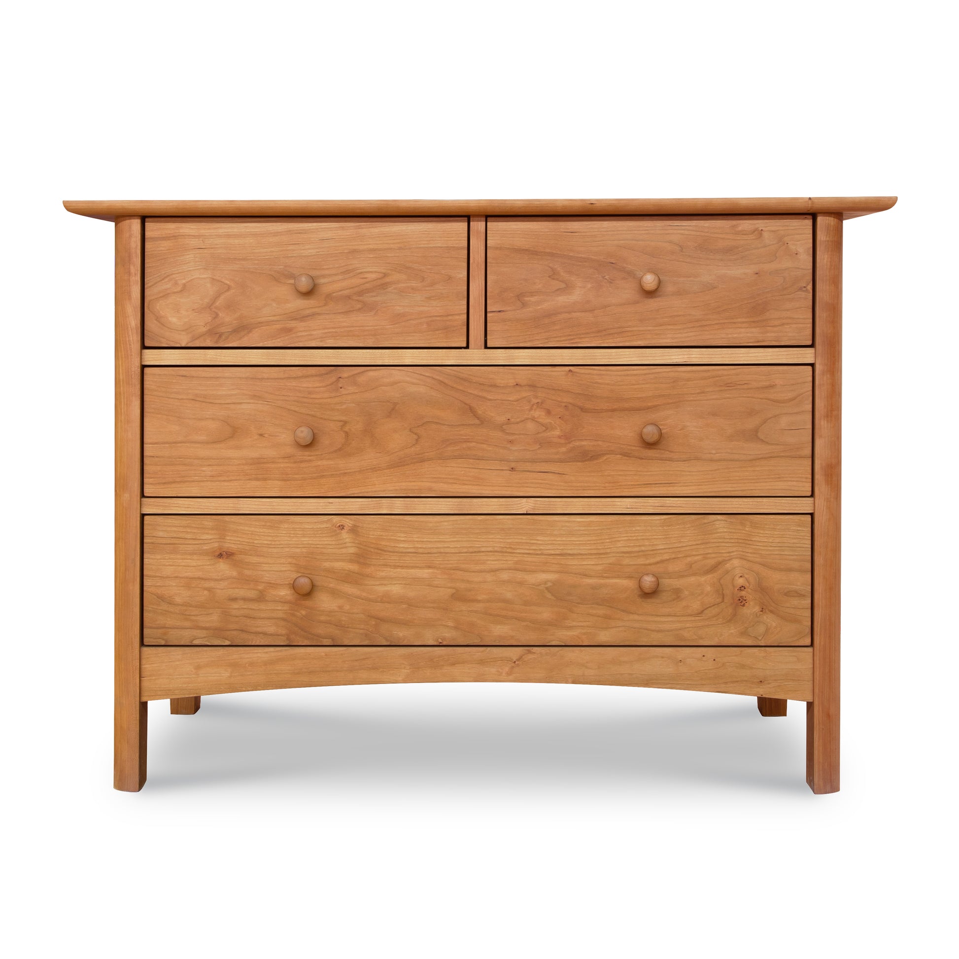 A luxurious Heartwood Shaker 4-Drawer Dresser by Vermont Furniture Designs on a white background.