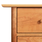 Heartwood Shaker 6-Drawer Dresser by Vermont Furniture Designs, highlighting the detailed wood grain and round knob craftsmanship.