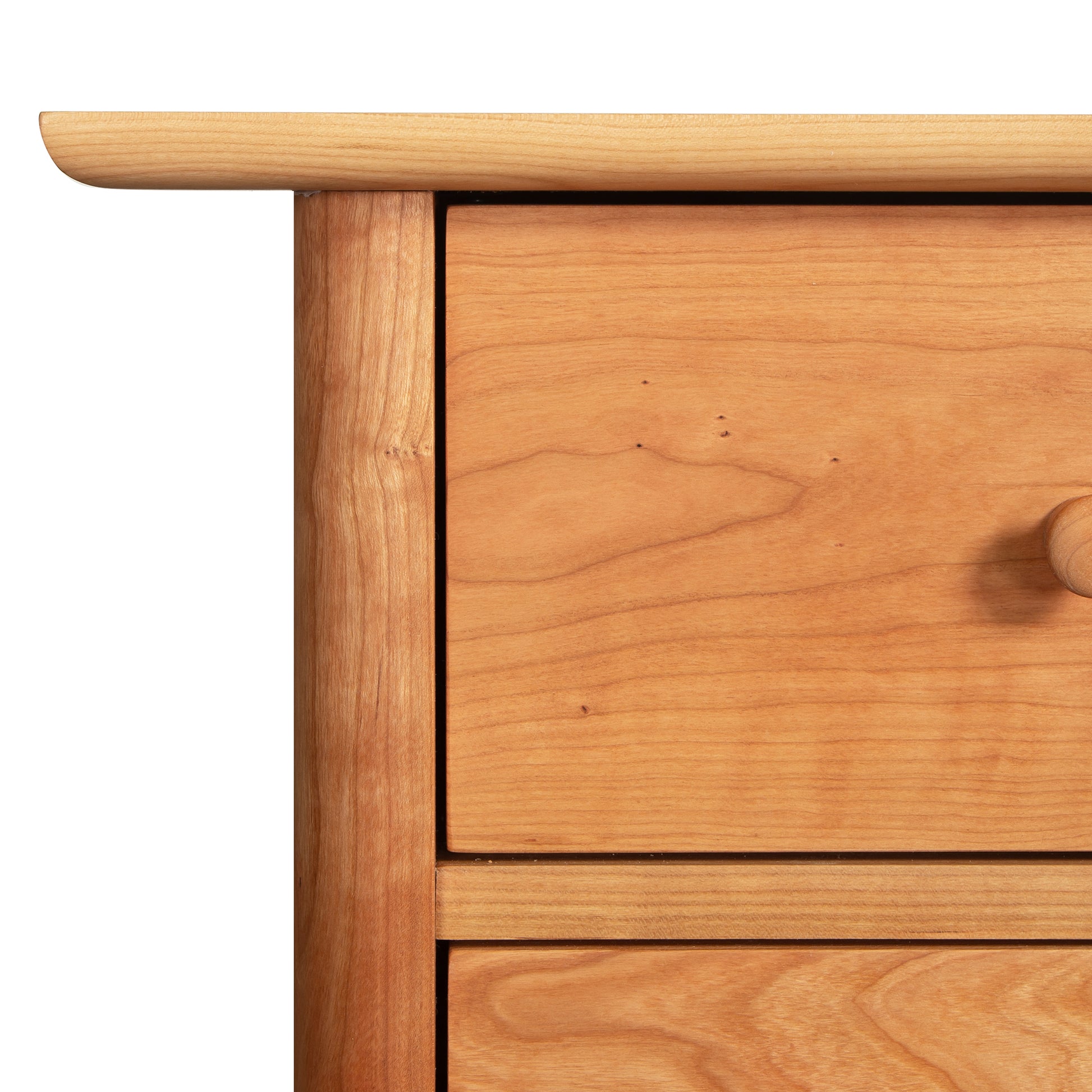 Heartwood Shaker 6-Drawer Dresser by Vermont Furniture Designs, highlighting the detailed wood grain and round knob craftsmanship.