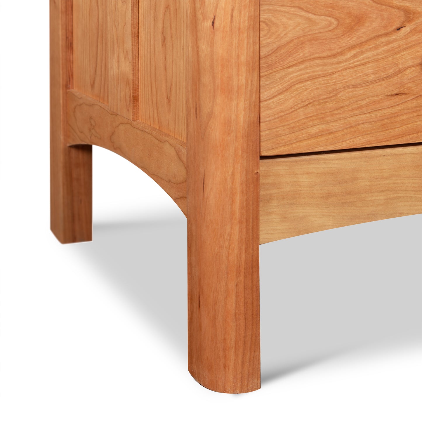 Heartwood Shaker 6-Drawer Dresser by Vermont Furniture Designs, featuring rounded legs and natural wood grain of finely crafted hardwood.