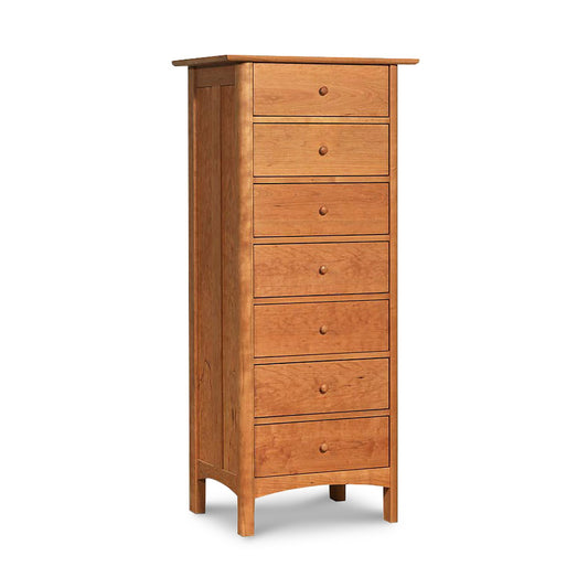 A tall Vermont Furniture Designs Heartwood Shaker 7-Drawer lingerie chest, standing against a white background, coated in an eco-friendly oil finish.