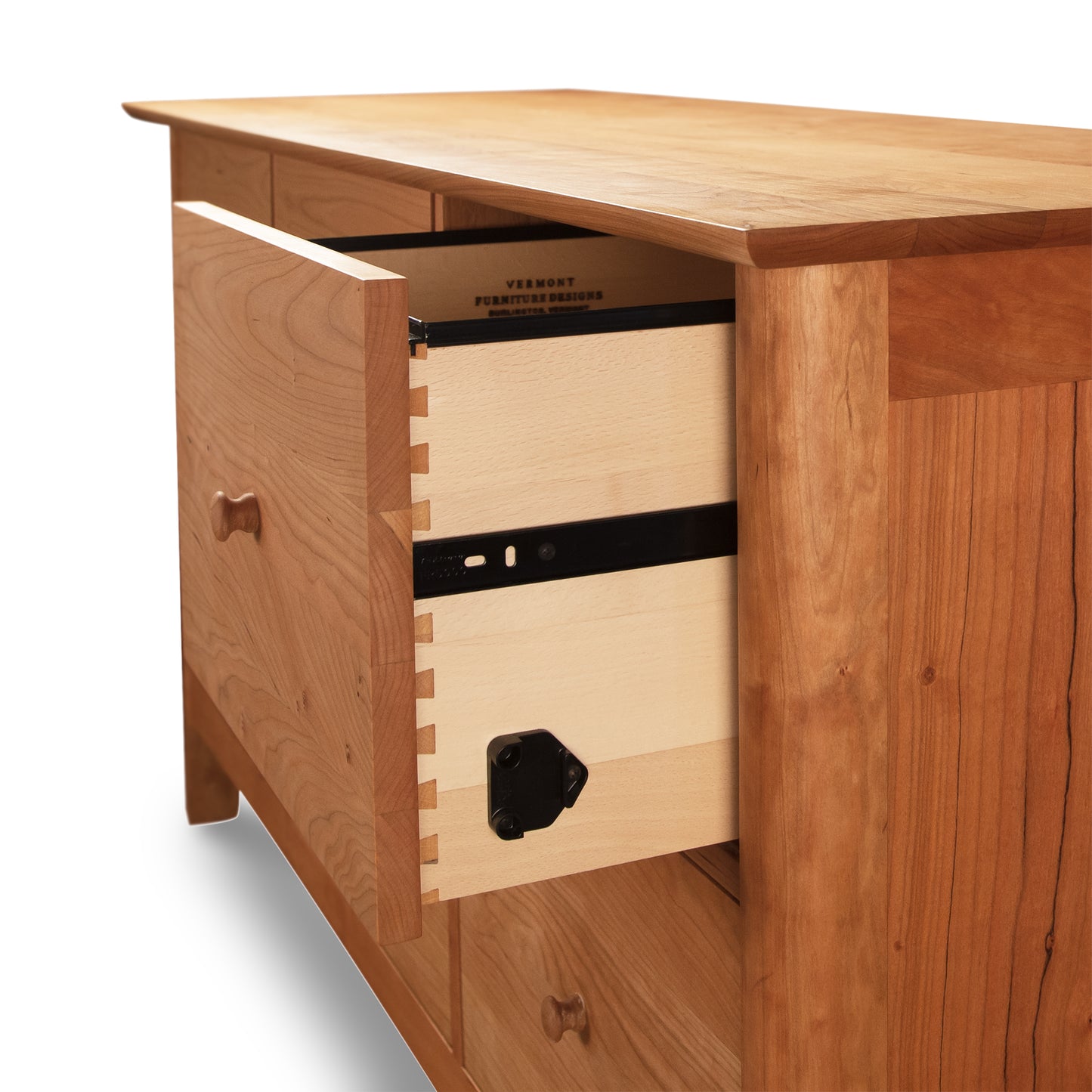 A Heartwood Shaker 6-Drawer Legal File Cabinet by Vermont Furniture Designs with an open drawer, revealing a black safe box mounted inside.