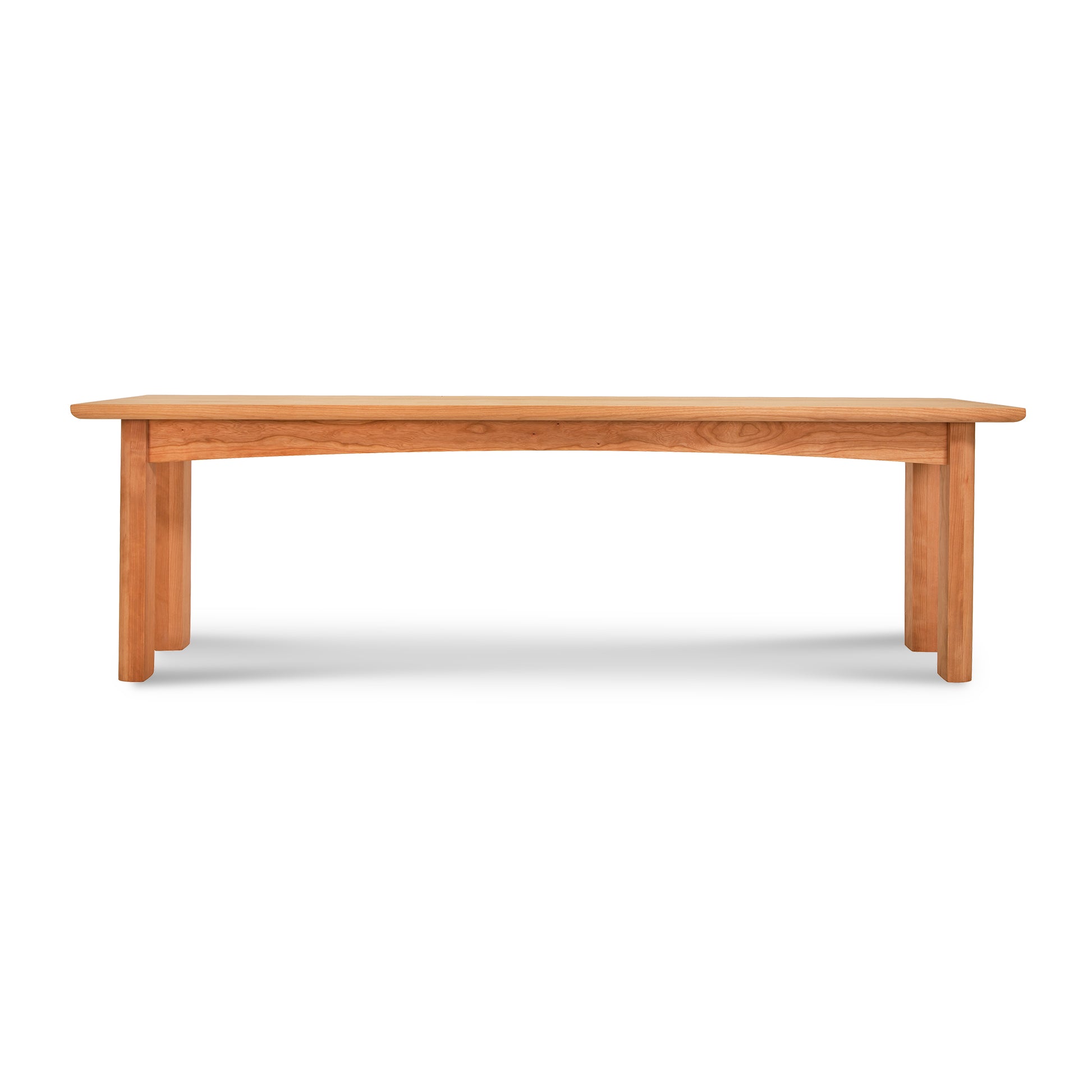 A Heartwood Shaker Bench by Vermont Furniture Designs isolated on a white background.