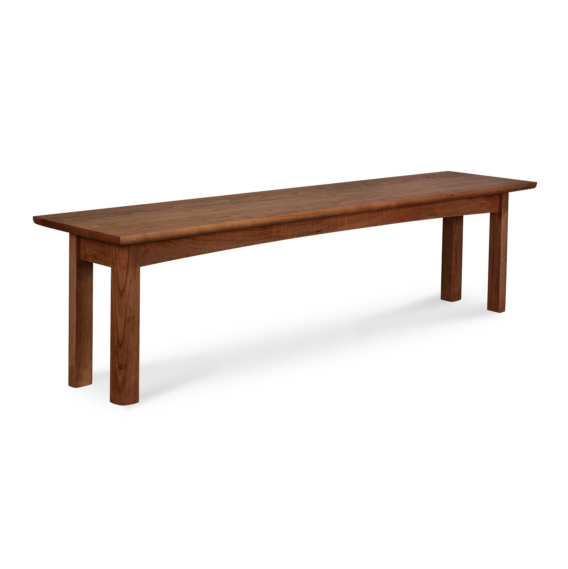 A Heartwood Shaker Bench by Vermont Furniture Designs isolated on a white background.