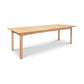 A Heartwood Shaker Extension Dining Table by Vermont Furniture Designs, with a light finish, featuring a rectangular top and four legs, set against a white background.