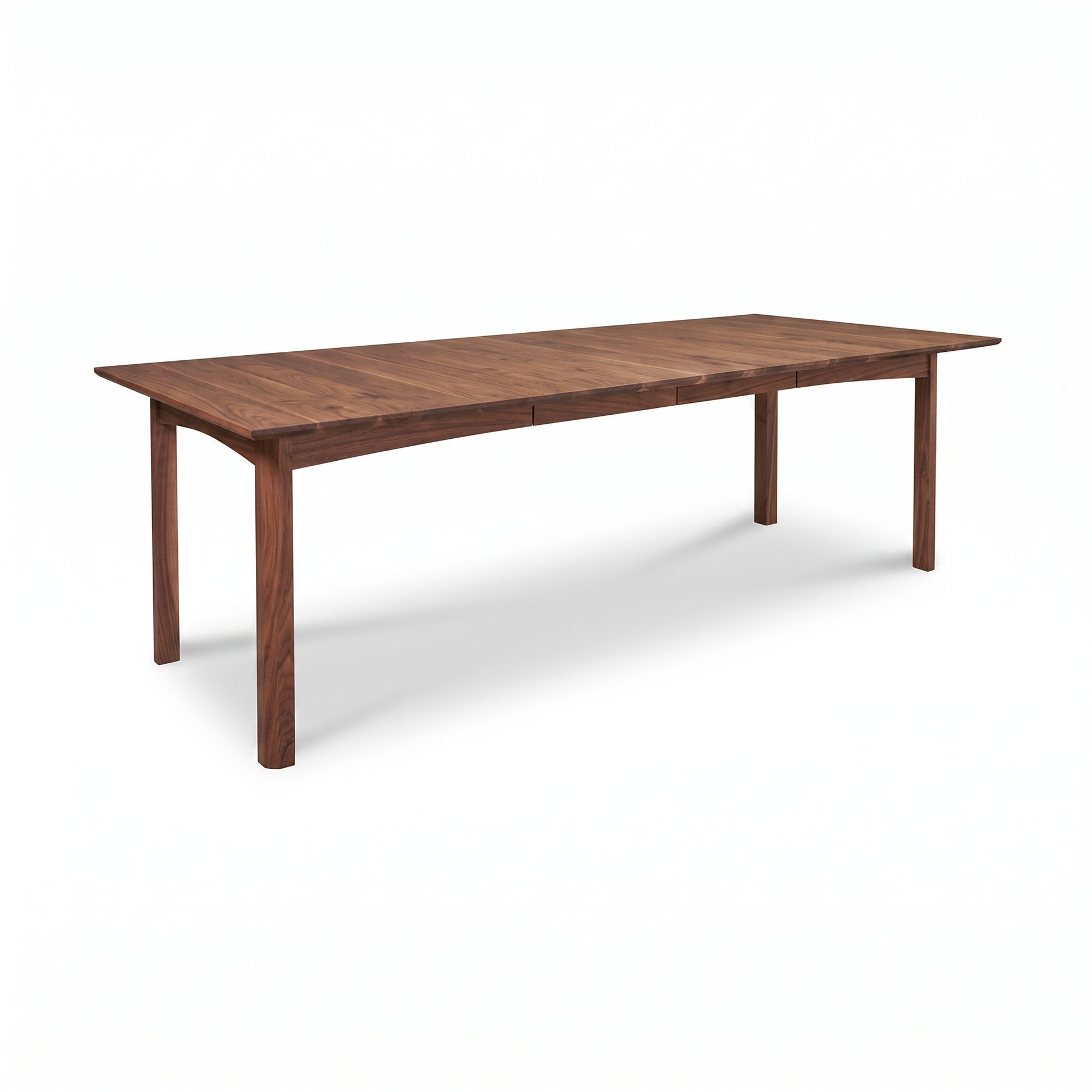 Heartwood Shaker Extension Dining Table by Vermont Furniture Designs with four straight legs, crafted in solid wood, shown standalone.