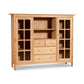 A handmade Vermont Furniture Designs Heartwood Shaker Home Office Center Cabinet with glass-panel doors and multiple compartments, isolated on a white background.
