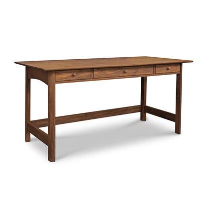 Heartwood Shaker Library Desk by Vermont Furniture Designs with three drawers, dark brown finish, and sturdy legs made from sustainably harvested wood. Elegant handmade wooden desk.