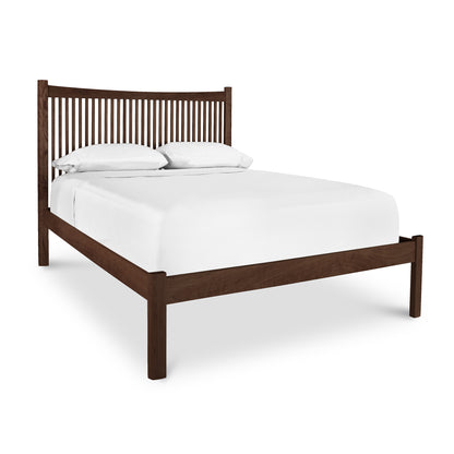 Heartwood Shaker Low Footboard Bed by Vermont Furniture Designs with white sheets and pillows.