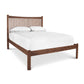 Heartwood Shaker Low Footboard Bed by Vermont Furniture Designs featuring a vertical slat headboard, shown with white bedding and pillows.