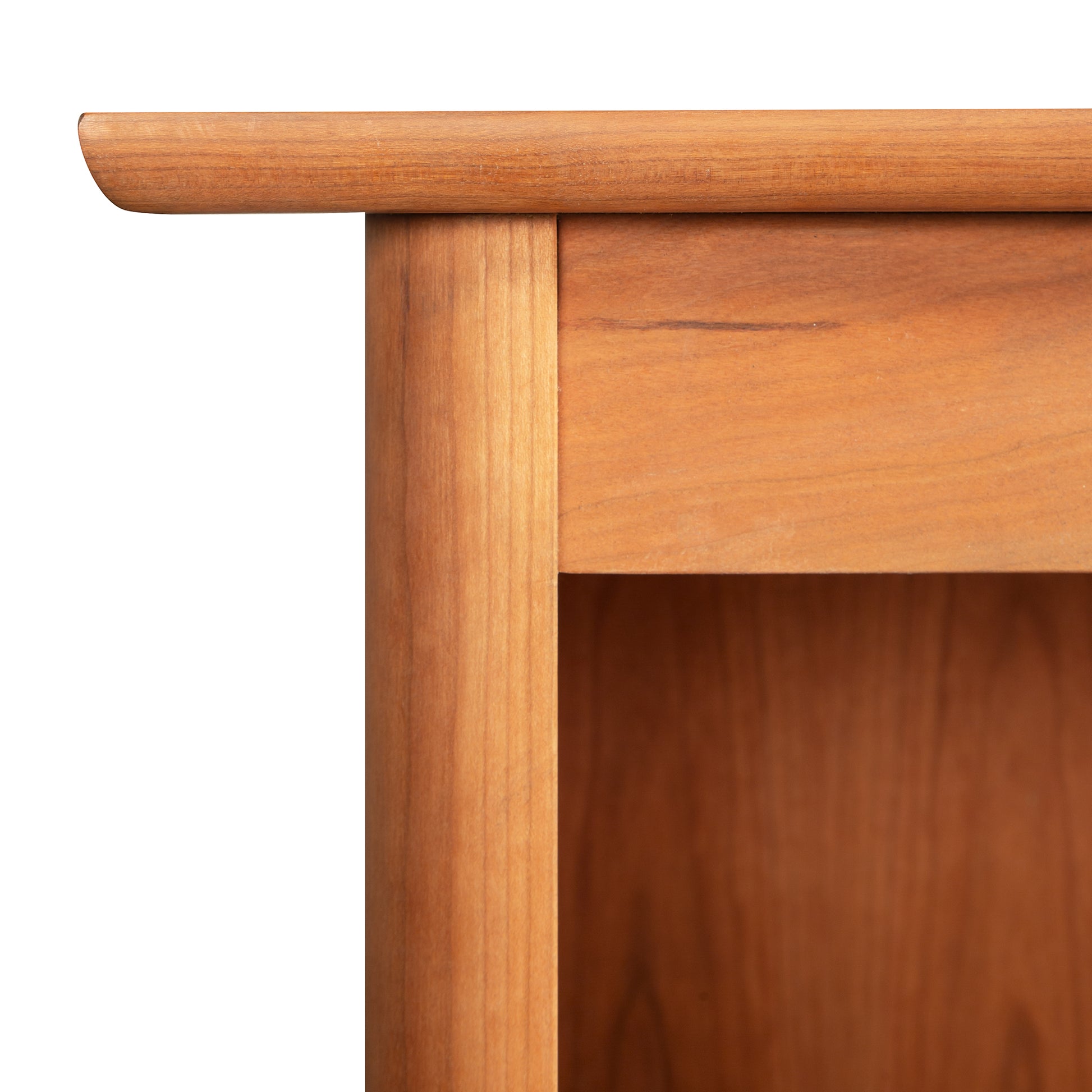 Detailed view of the top left corner of the Heartwood Shaker Open Console Bookcase, handcrafted by Vermont Furniture Designs in solid wood.
