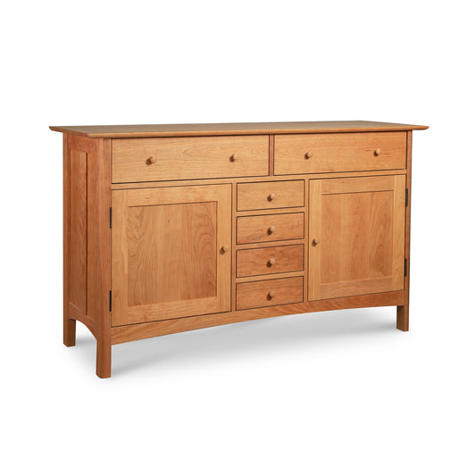 A Vermont Furniture Designs Heartwood Shaker Sideboard, crafted from solid hardwoods, with multiple drawers and cabinets against a white background.