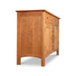 A Vermont Furniture Designs Heartwood Shaker sideboard crafted from solid hardwoods, with multiple drawers, isolated on a white background.