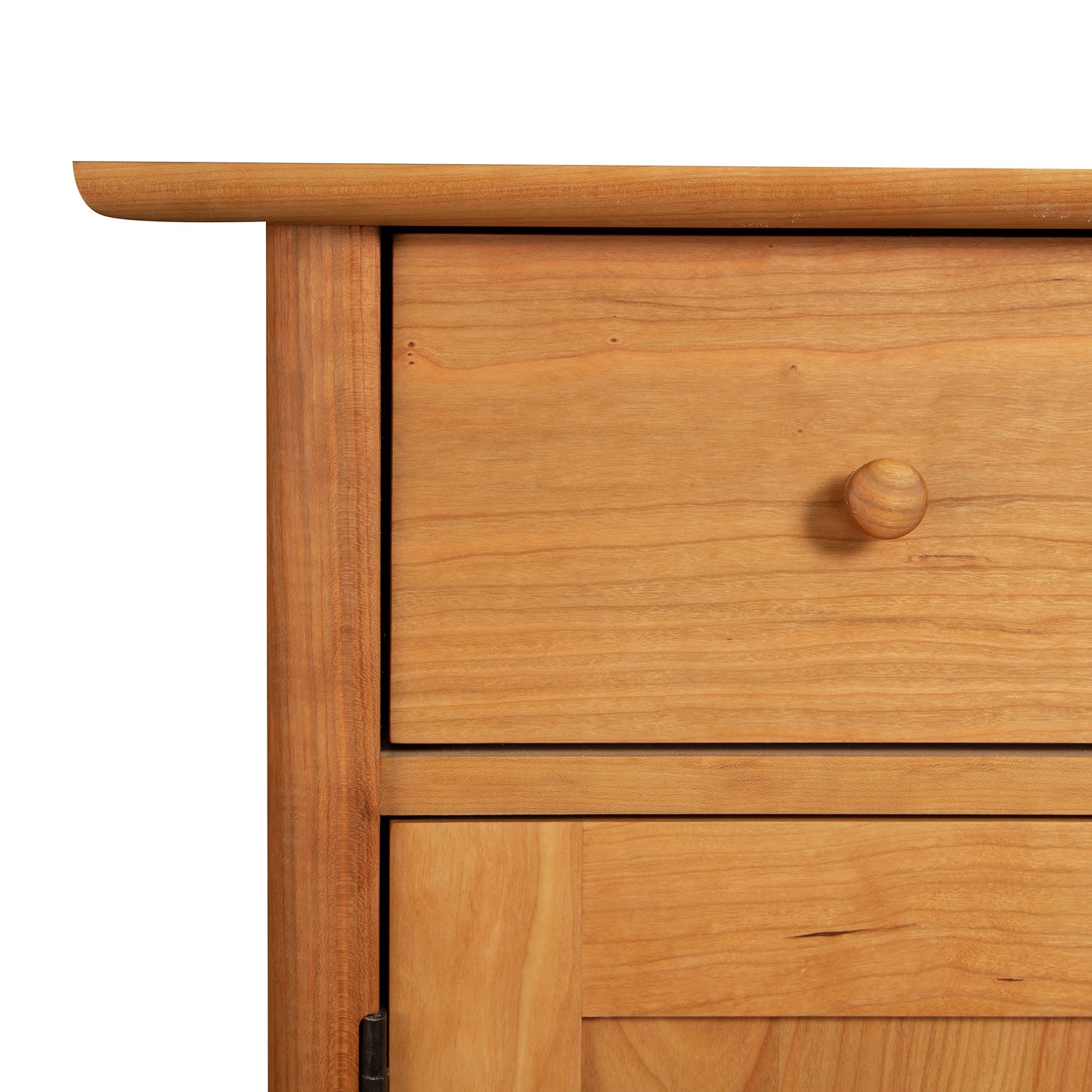 Vermont Furniture Designs Heartwood Shaker sideboard with a drawer partly open, isolated on a white background.
