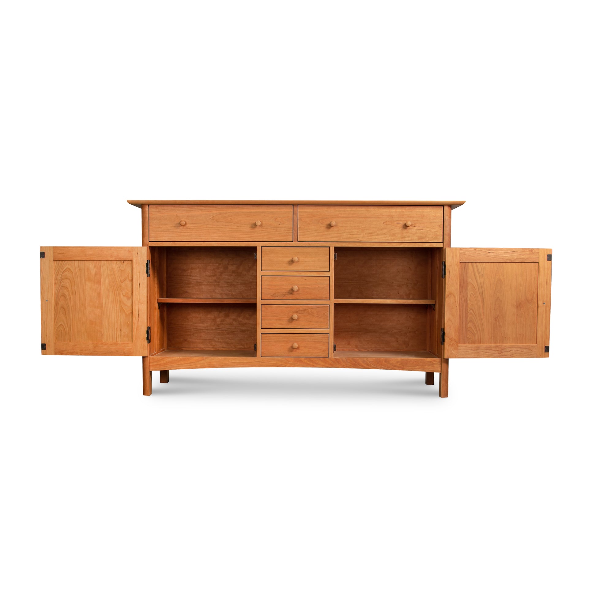 A Vermont Furniture Designs Heartwood Shaker Sideboard crafted from solid hardwoods with open doors and drawers revealing internal shelves and compartments, isolated on a white background.