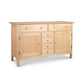 Heartwood Shaker Sideboard by Vermont Furniture Designs featuring 2 top drawers, 5 central drawers, and side cabinets.