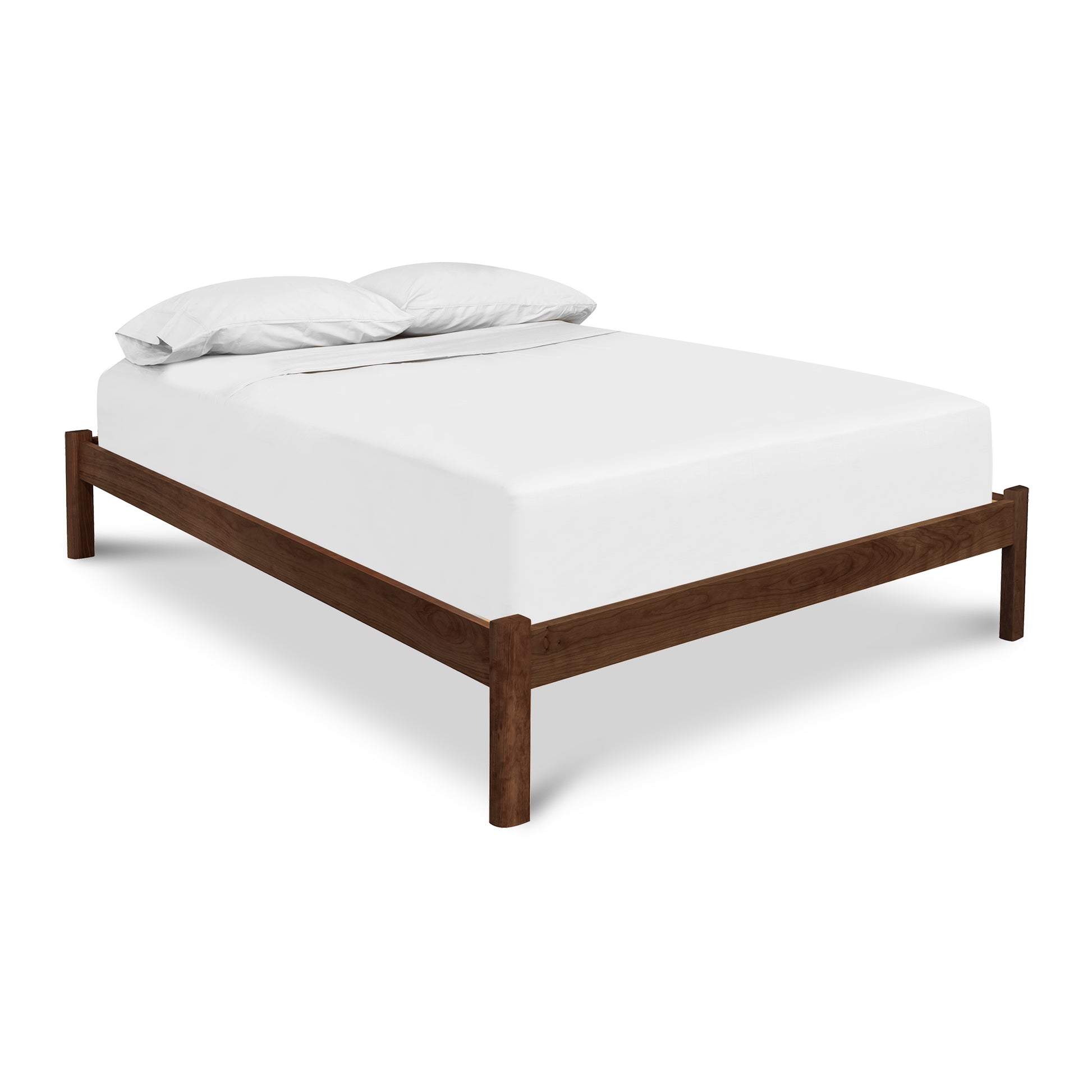 Heartwood Shaker Studio-Style Platform Bed by Vermont Furniture Designs, showcasing clean lines and minimalist design with white bedding.