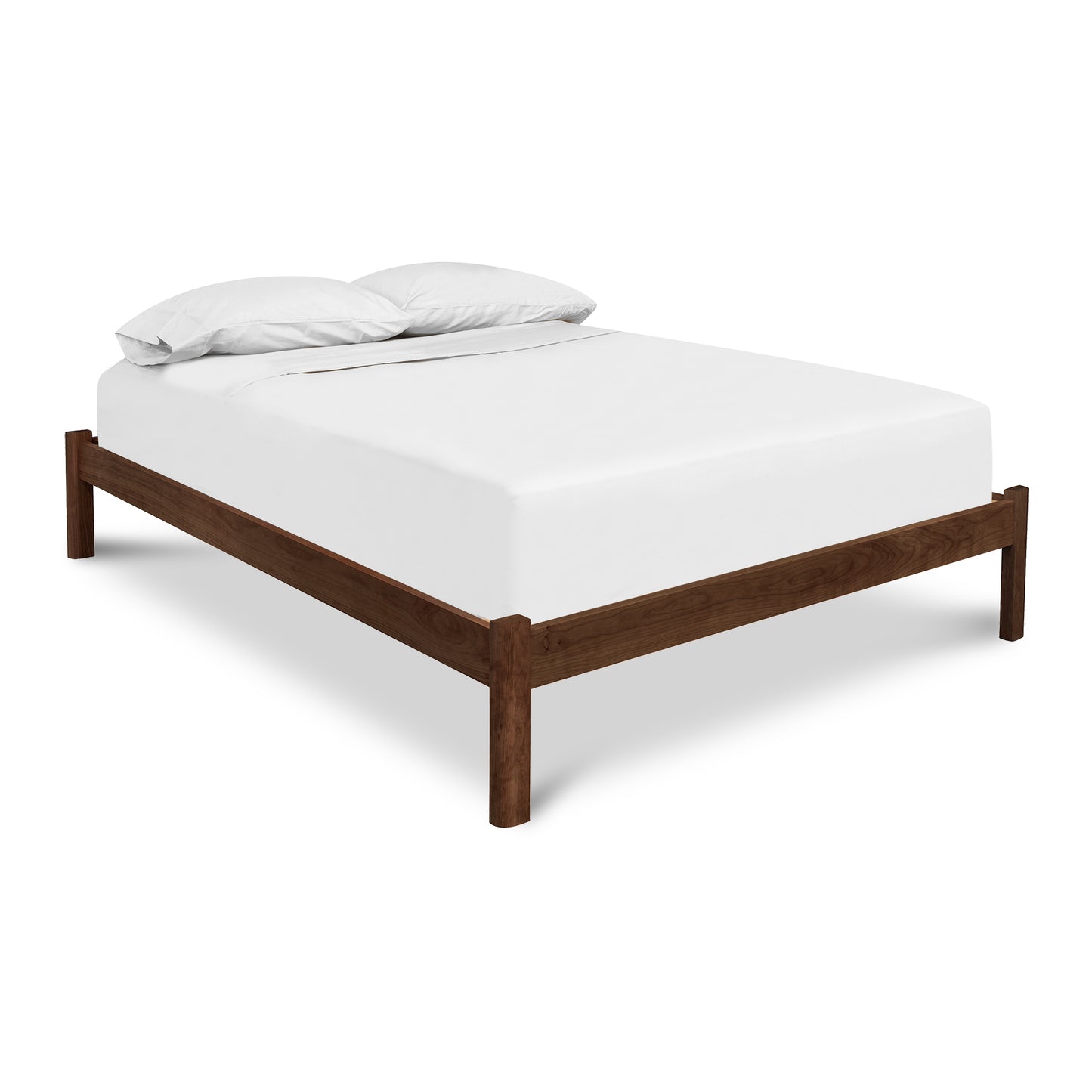 Minimalist Heartwood Shaker Platform Bed by Vermont Furniture Designs featuring a white mattress and pillows, handcrafted in Vermont.