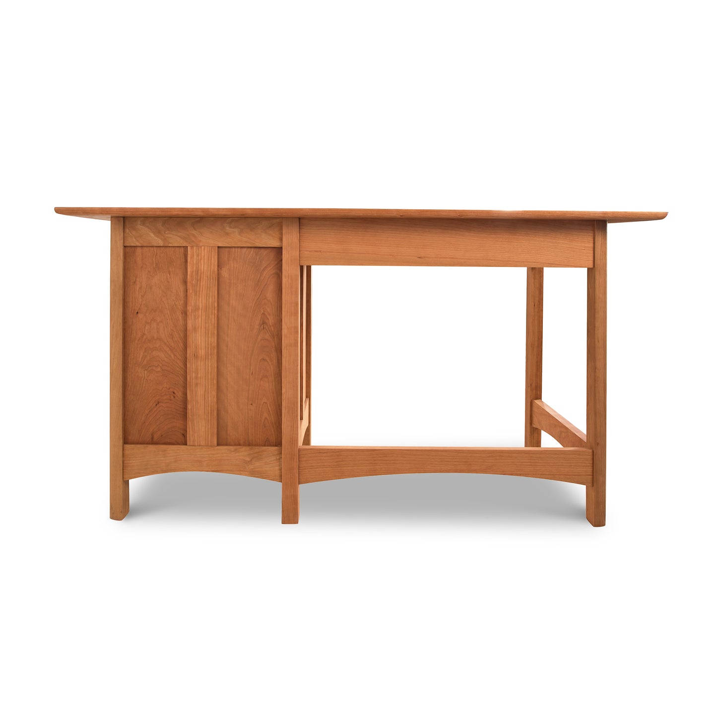 Vermont Furniture Designs Heartwood Shaker Study Desk with a single side cabinet and an open space for seating, isolated on a white background.