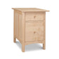 Light wood nightstand with two drawers and round knobs, crafted in the classic Shaker style by Vermont Woods Studios.