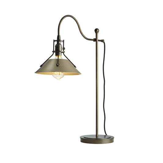 The Hubbardton Forge Henry Table Lamp combines industrial design with a sleek metal shade, creating a stylish lighting option.