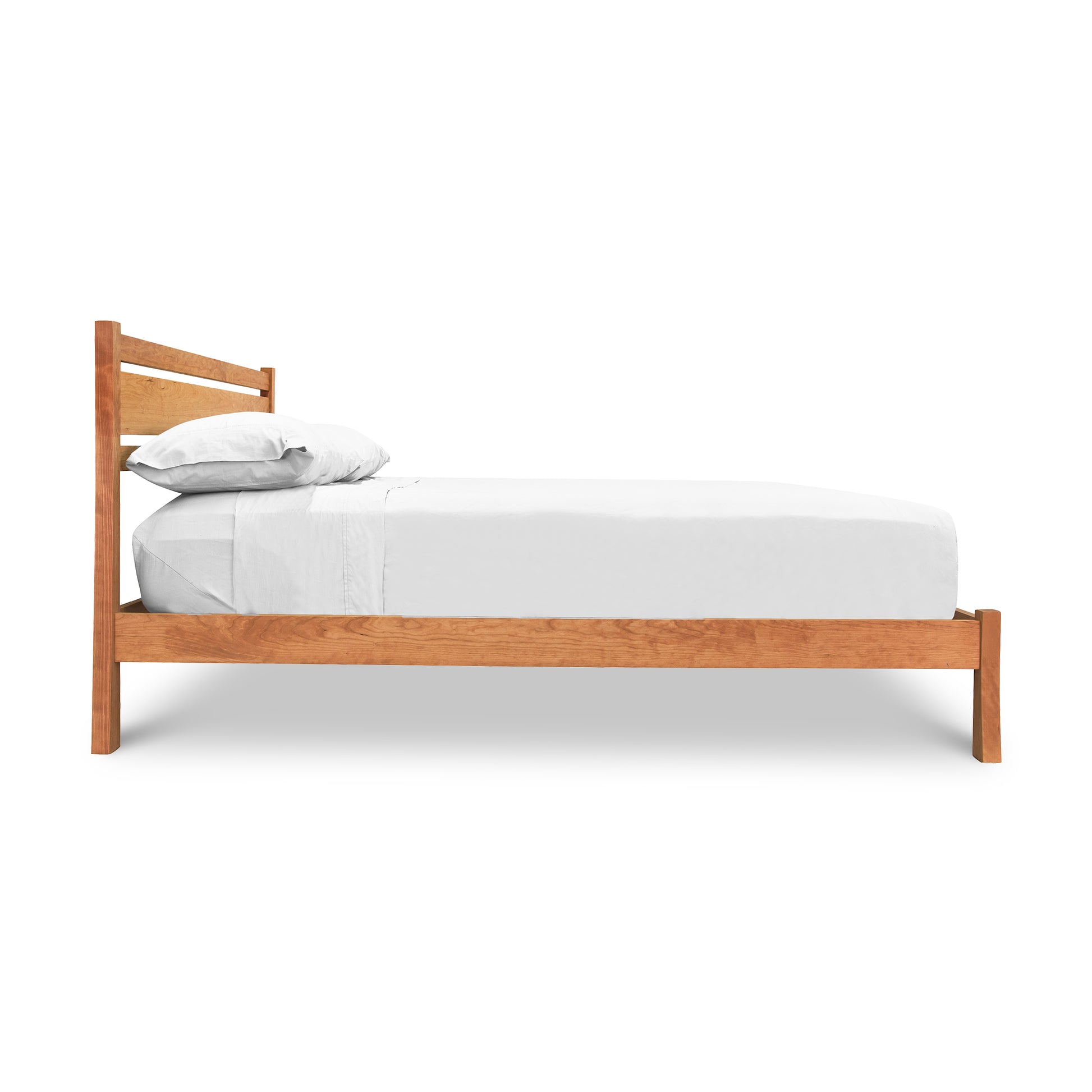 Vermont Furniture Designs Horizon Platform Bed in cherry wood, queen size, featuring elegant craftsmanship and white bedding, side profile view.