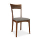 Ingrid Chair by Copeland Furniture with curved back and gray upholstered seat in solid cherry wood, crafted in America.