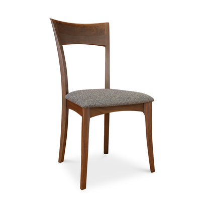 Ingrid Chair by Copeland Furniture with curved back and gray upholstered seat in solid cherry wood, crafted in America.