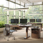 Copeland Furniture's Invigo Sit-Stand Desk and ergonomic office chairs showcased in a modern workspace, highlighting American made craftsmanship.