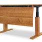 Invigo Sit-Stand Desk by Copeland Furniture with a cherry rectangular top, solid modesty panel, and adjustable black metal legs, handcrafted in Vermont.