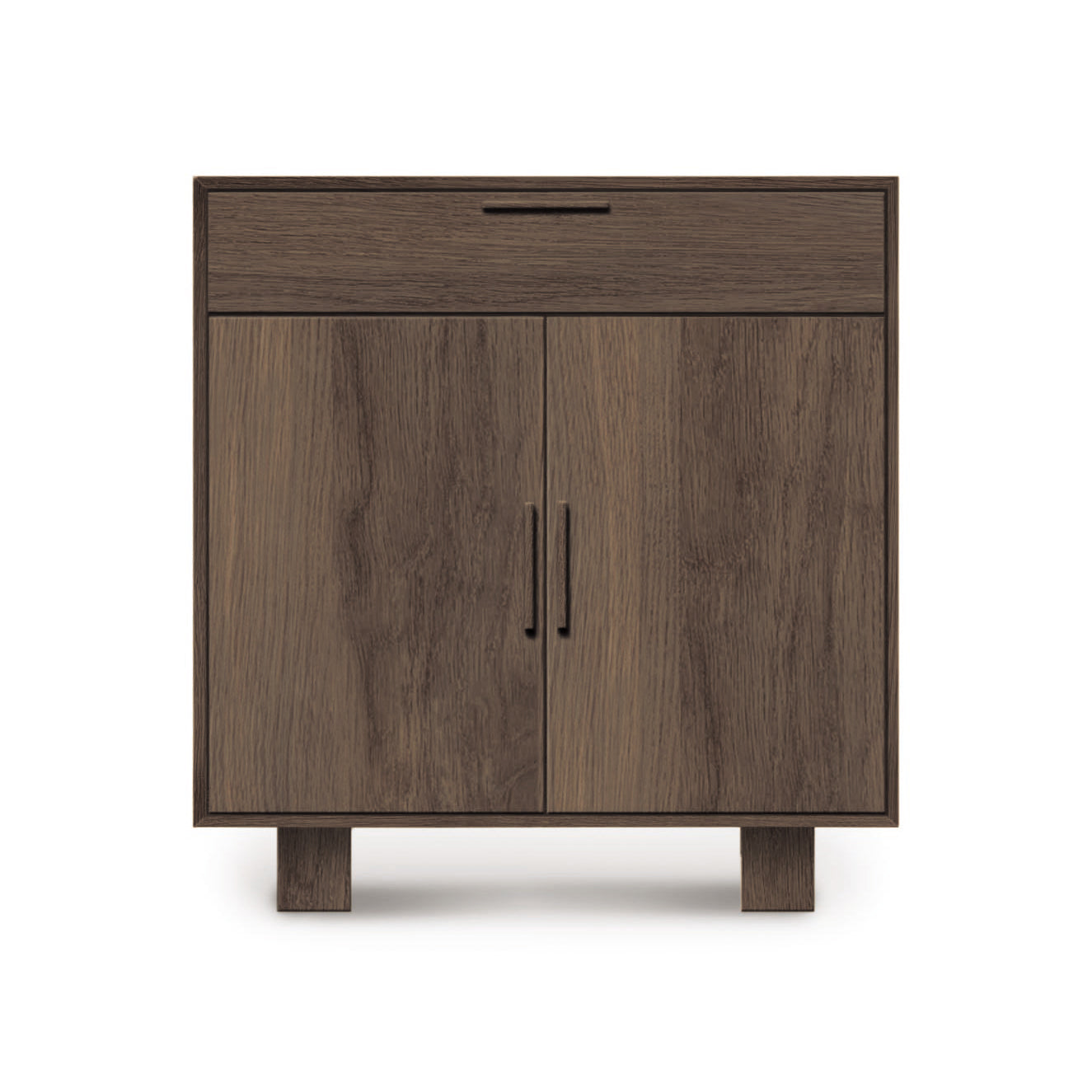 A Copeland Furniture Iso 2 Door, 1 Drawer Buffet with a Mid-Century Modern Style wooden cabinet with a single drawer and double doors, standing on four legs, isolated on a white background.