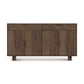 An Iso 4 Door, 2 Drawer Buffet from Copeland Furniture, solid oak wood sideboard with sliding doors and a flat top, isolated against a white background.