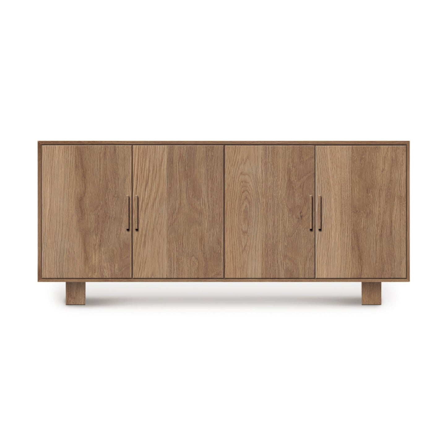 A mid-century modern Copeland Furniture Iso Oak 4-Door Buffet, made from solid hardwood oak, with short legs, isolated on a white background.