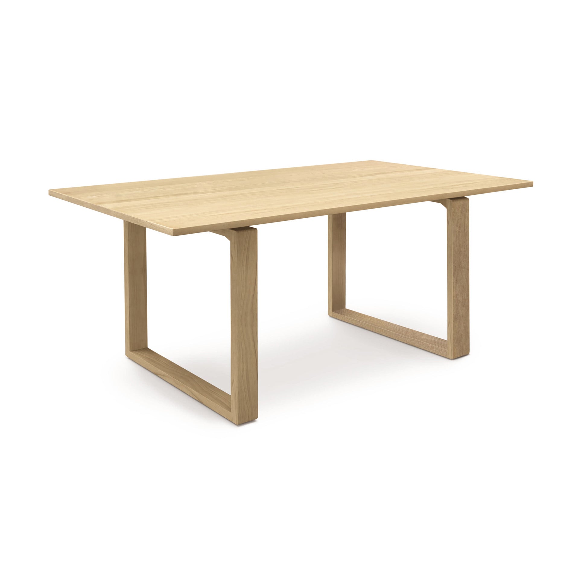 A wooden dining table with a rectangular top and two wide, squared legs, displayed against a white background. This Copeland Furniture Iso Oak Solid Top Dining Table is crafted from sustainably sourced North American hardwoods.