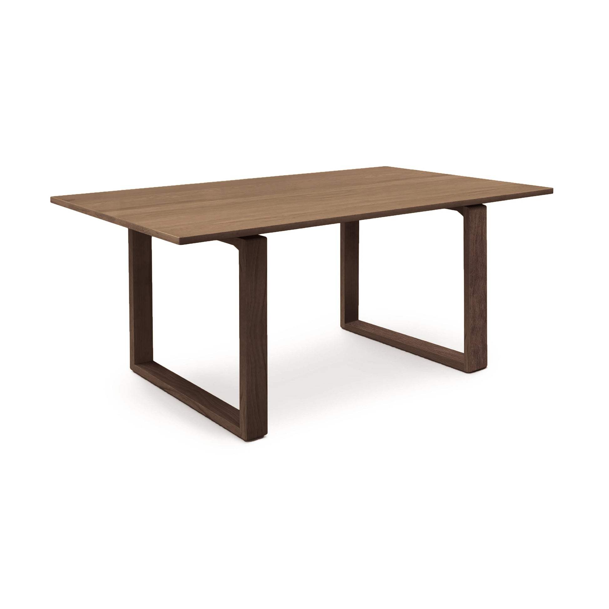 A minimalist Copeland Furniture Iso Oak Solid Top Dining Table with a rectangular top and two wide, inverted u-shaped legs on a white background, crafted from sustainably sourced North American hardwoods.
