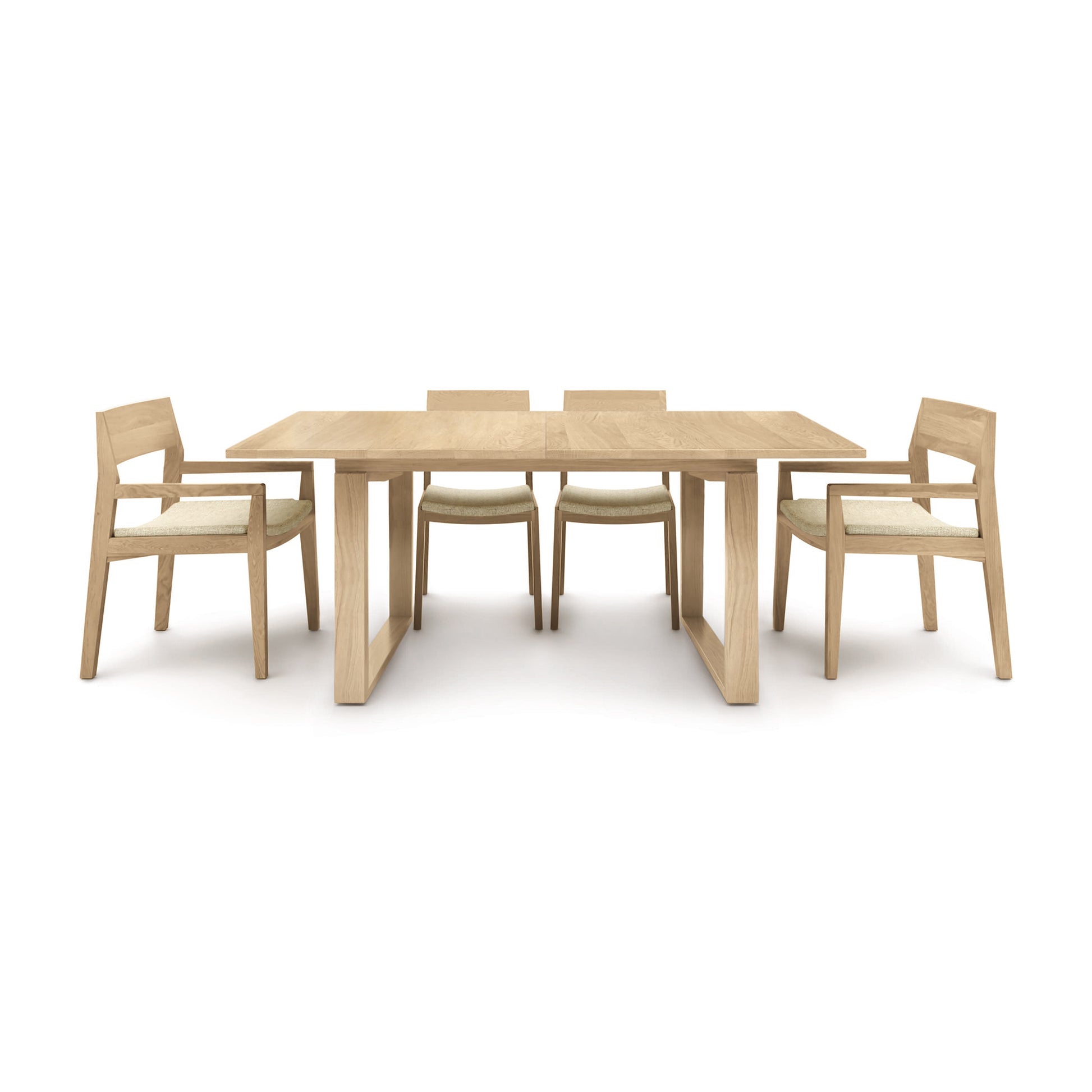 A Copeland Furniture Iso Extension Dining Table with four chairs on a white background.
