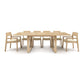 A Iso Extension Dining Table with six chairs from Copeland Furniture on a white background.